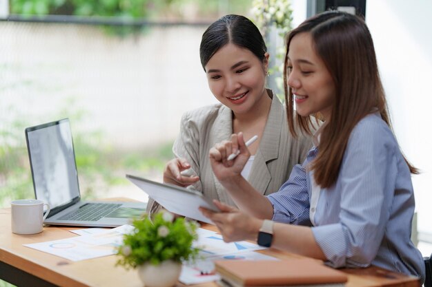 Financial Analyst discussing with Investment Banker at Meeting Room Fund investment concept