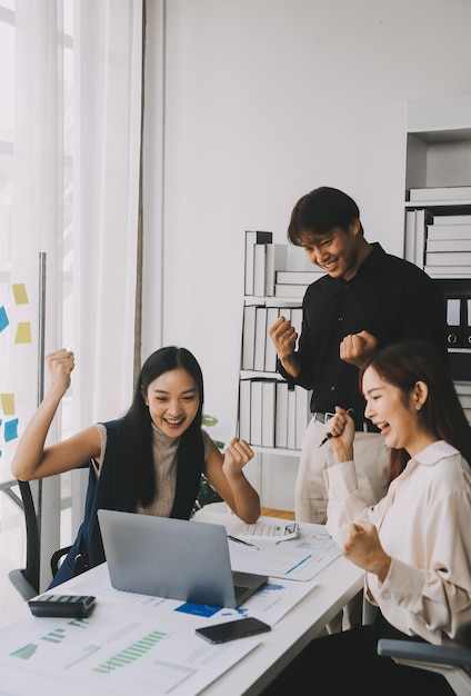 Financial analysts analyze business financial reports on a digital tablet planning investment project during a discussion at a meeting of corporate showing the results of their successful teamwork