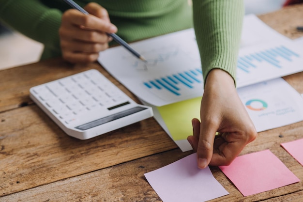 Financial analysts analyze business financial reports on a digital tablet planning investment project during a discussion at a meeting of corporate showing the results of their successful teamwork