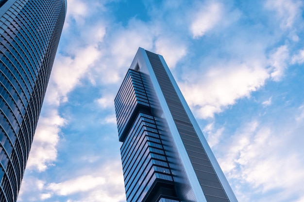 Financial area with glass buildings seen from below at sunrise modern office building