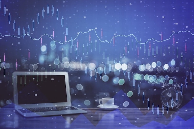 Financial chart drawing and table with computer on background Multi exposure Concept of international markets