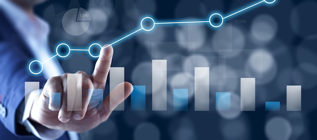 Financial charts showing growing revenue on touch screen