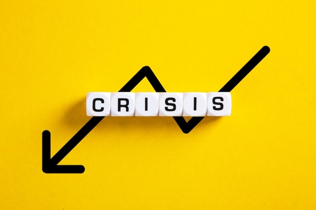 Financial crisis word over yellow background
