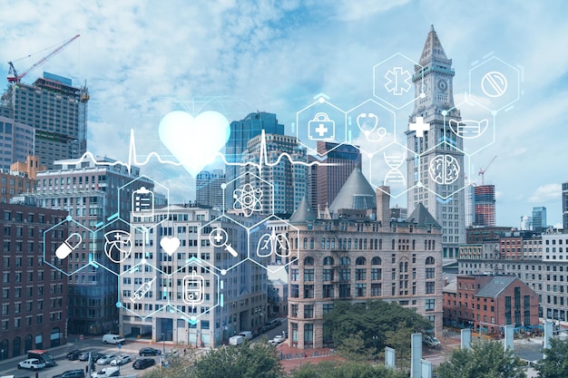 Foto panorama di vista della città del centro finanziario di boston dall'area del porto durante il giorno massachusetts icone luminose della medicina digitale sanitaria il concetto di trattamento dalla malattia minaccia di pandemia