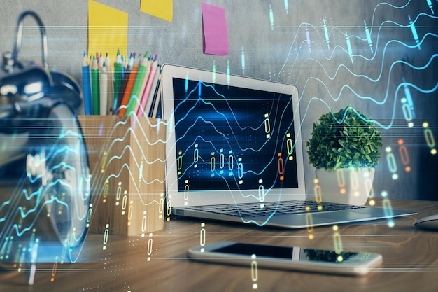 Financial graph colorful drawing and table with computer on background Double exposure Concept of international markets