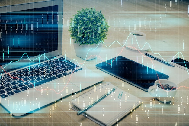 Financial graph colorful drawing and table with computer on background Double exposure Concept of international markets