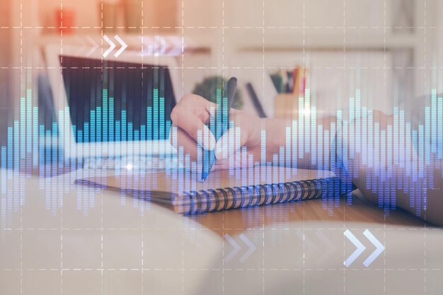 Financial graph displayed on woman's hand taking notes background Concept of research Double exposure