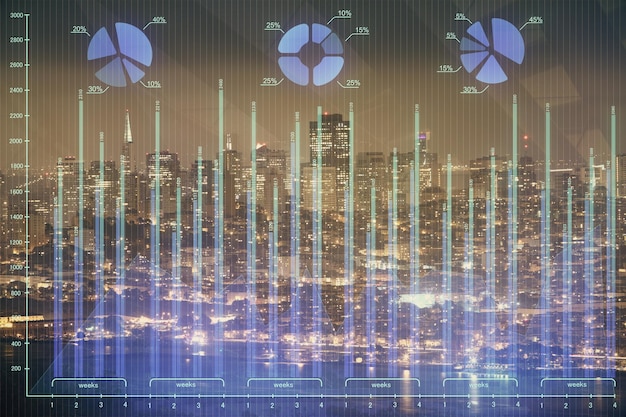 Financial graph on night city scape with tall buildings background double exposure Analysis concept