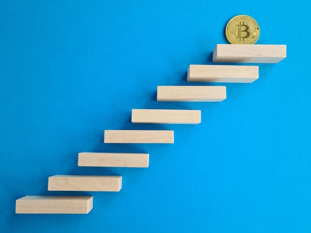 Photo financial growth concept with bitcoin ladder closeup