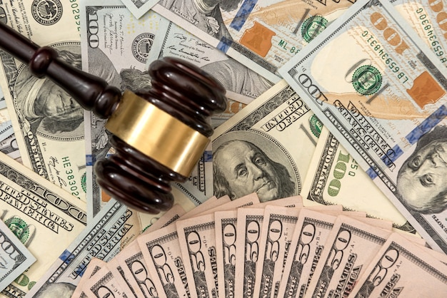 Financial judges gavel with dollars  corruption crimes