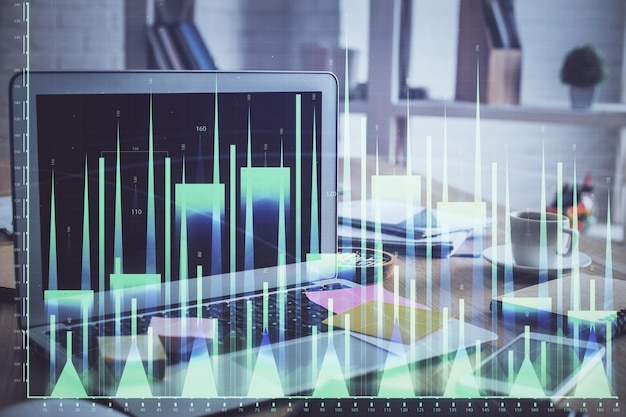 Financial market graph hologram and personal computer on background Double exposure Concept of forex