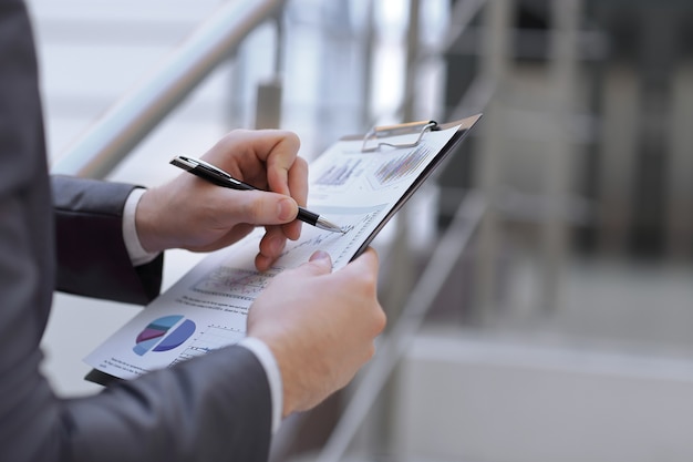 Photo financial report in the hands of a businessman.