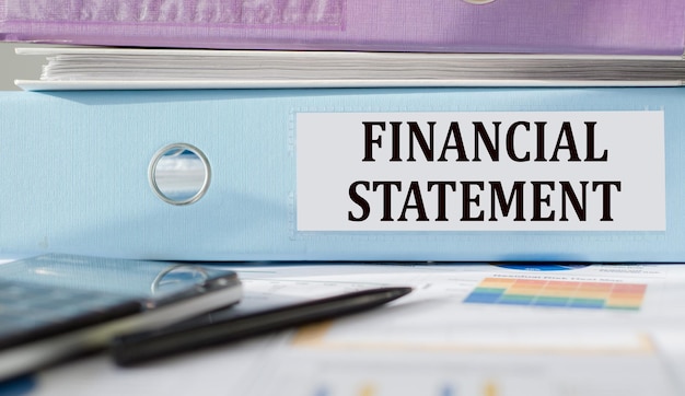 Financial Statement text written on folder with documents and calculator