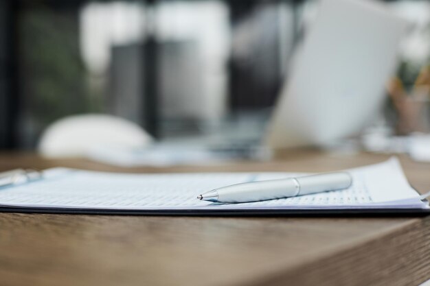 Financial statistics documents ball pen infographics at office table closeup