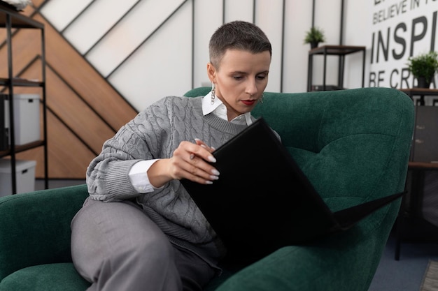 Financier woman working with folders of papers in the office