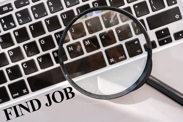 Photo a find job text on the keyboard computer, opportunity vacations search