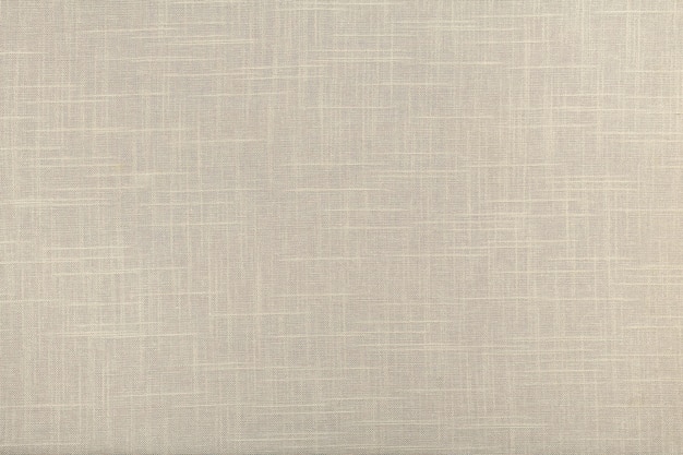 Finely textured background of beige linen fabric