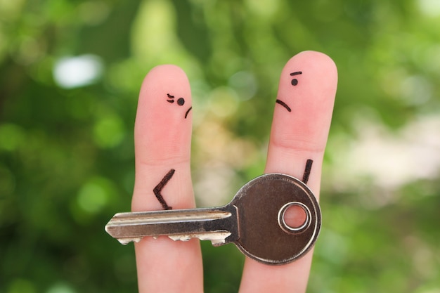     Finger art of family during quarrel. Concept of man and woman can not divide property after divorce. 