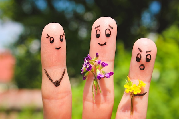 Finger art. Men give flowers flowers to a woman. 