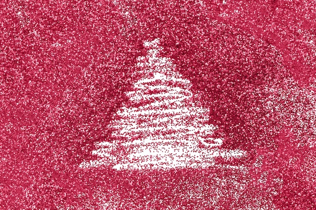 Finger drawn christmas tree on shiny red confetti background