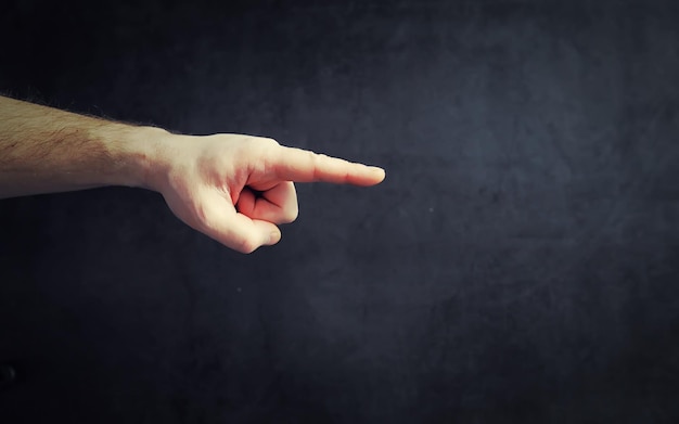 Finger gestures Male hands on a gray background Gesticulation with hands