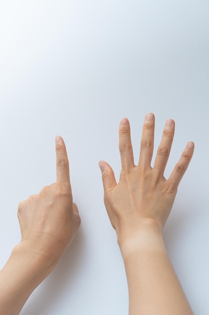 Photo finger gestures in various actions on a white background