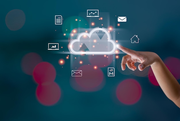 Finger pointing at the hologram cloud Represents search communication data storage with cloud computing