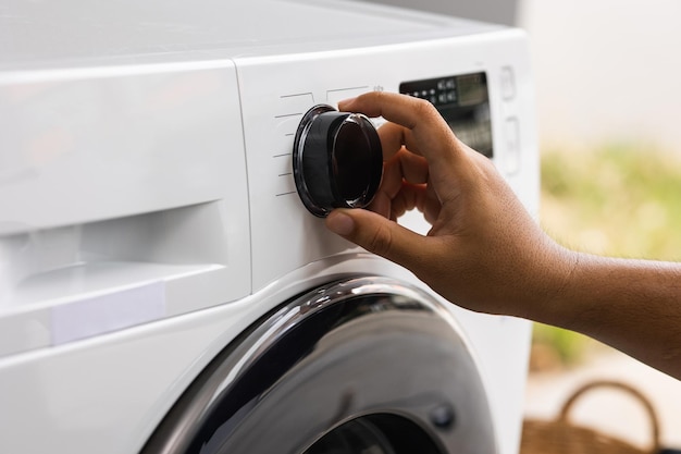 finger press the switch to make the washing machine work. home appliances