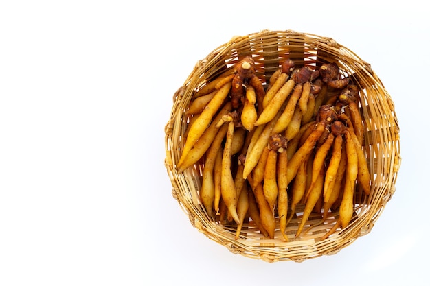 Finger root in bamboo basket on white background.