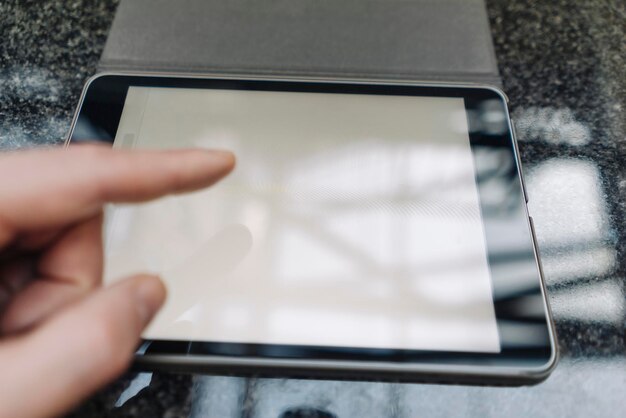 Photo finger touching tablet display