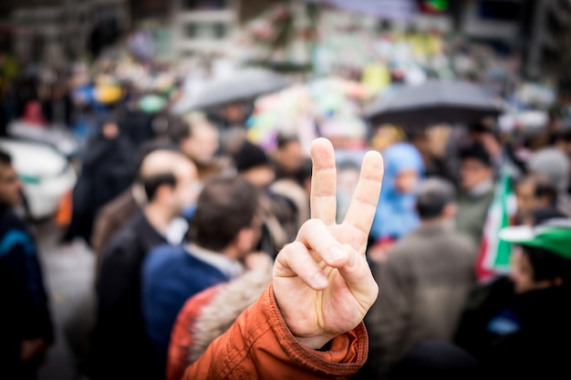 Photo finger victory symbol on protest