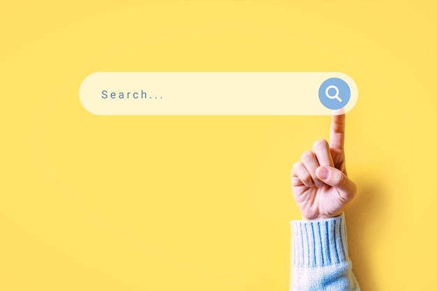 finger of woman clicking internet search page on computer touch screen
