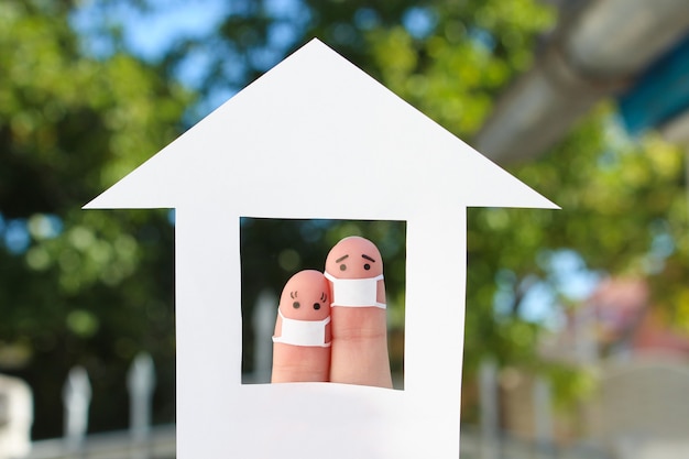 Fingers art of couple with face mask at home.