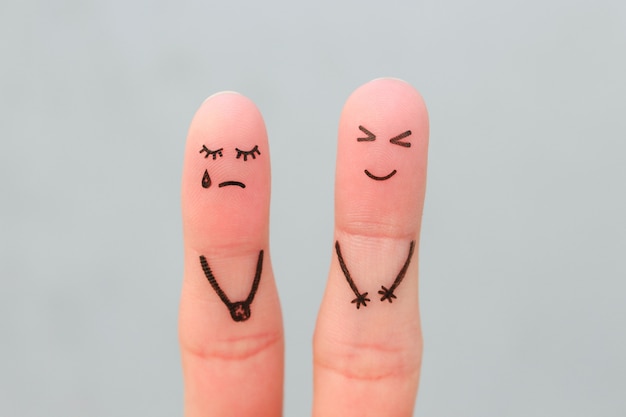 Fingers art of couple. Woman cries, man laughs.