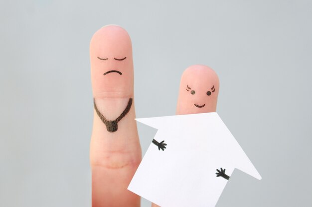 Fingers art of family during quarrel. Concept of man and woman divide house after divorce.