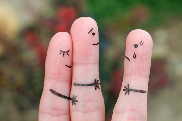 Photo fingers art of happy couple a man loves another woman the concept of unrequited love
