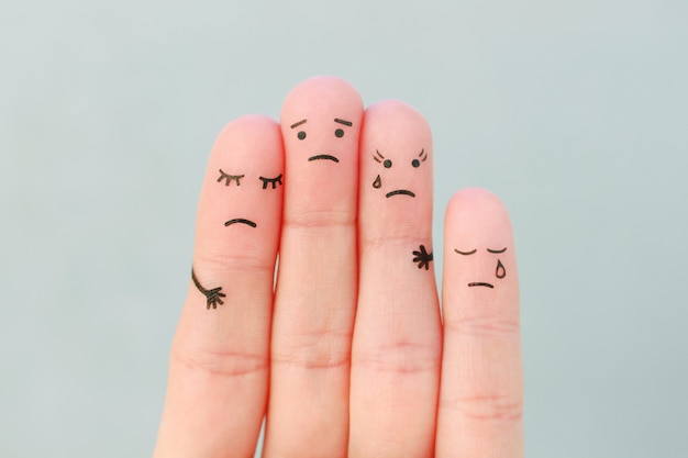 Photo fingers art of sad family. concept of support in difficult situations.