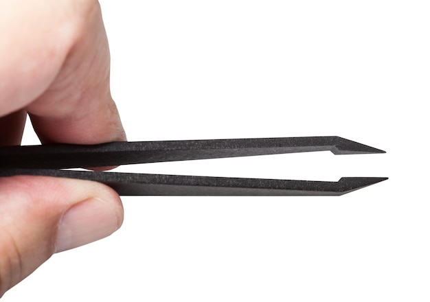 Photo fingers hold plastic tweezers with sharp tips