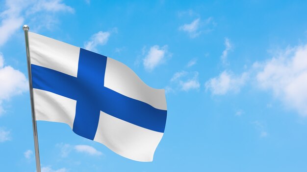 Bandiera della finlandia in pole. cielo blu. bandiera nazionale della finlandia