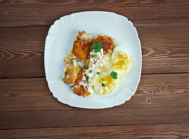 Finnan Haddie -  traditional Scottish  breakfast. smoked haddock cooked with egg and sauce