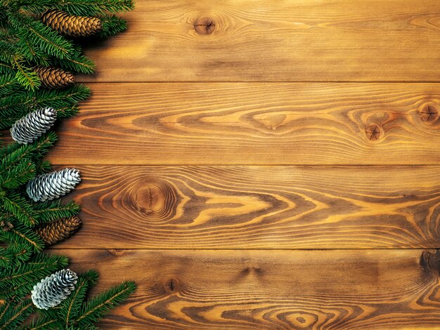 Fir branches on the wooden board. Christmas and New year background