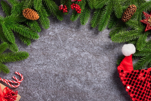 Fir tree branches with Xmas decoration and Santa hat