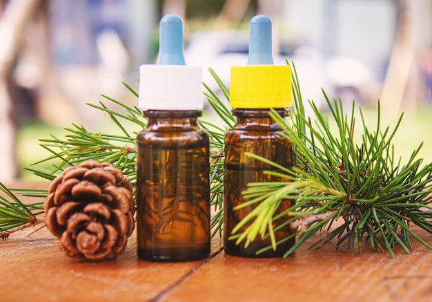 Fir tree essential oil in small bottles Selective focus