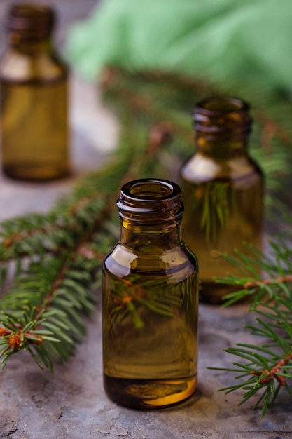 Fir tree essential oil in small bottles. Selective focus