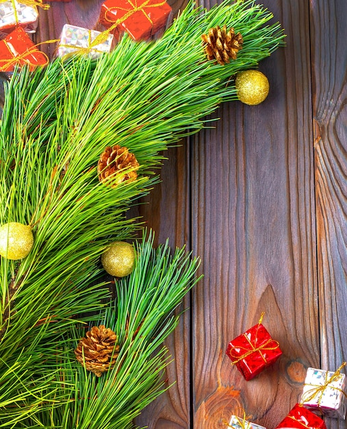 fir-tree with toys and gifts on wooden