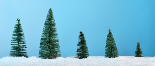 Fir trees on blue