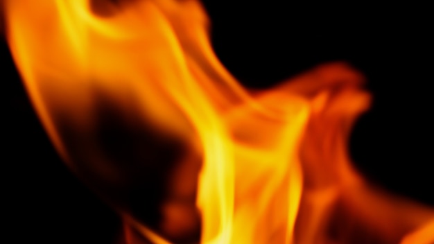 Фото Фон огня. абстрактное горящее пламя и черный фон. представляет силу горения относится к теплу, пряному соблазнительному, чувственному или горящему топливу. пожарные инциденты горение уничтожает все.