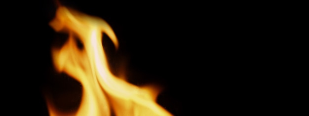 Fire background. Abstract burning flame and black background. represents the power of burning refers to heat spicy seductive sensual or burning fuels. fire incidents burning destroys everything.