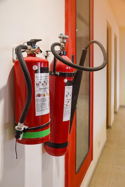 Photo fire extinguisher and gas pump system on the wall powerful emergency fire extinguisher equipment fire retardant fireproof