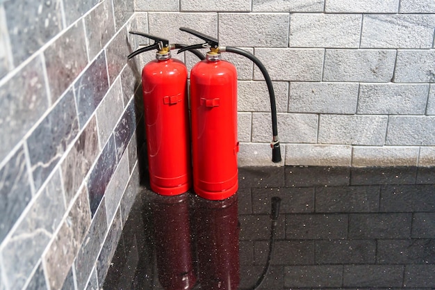 Fire extinguisher system on the wall background powerful emergency equipment for industrial